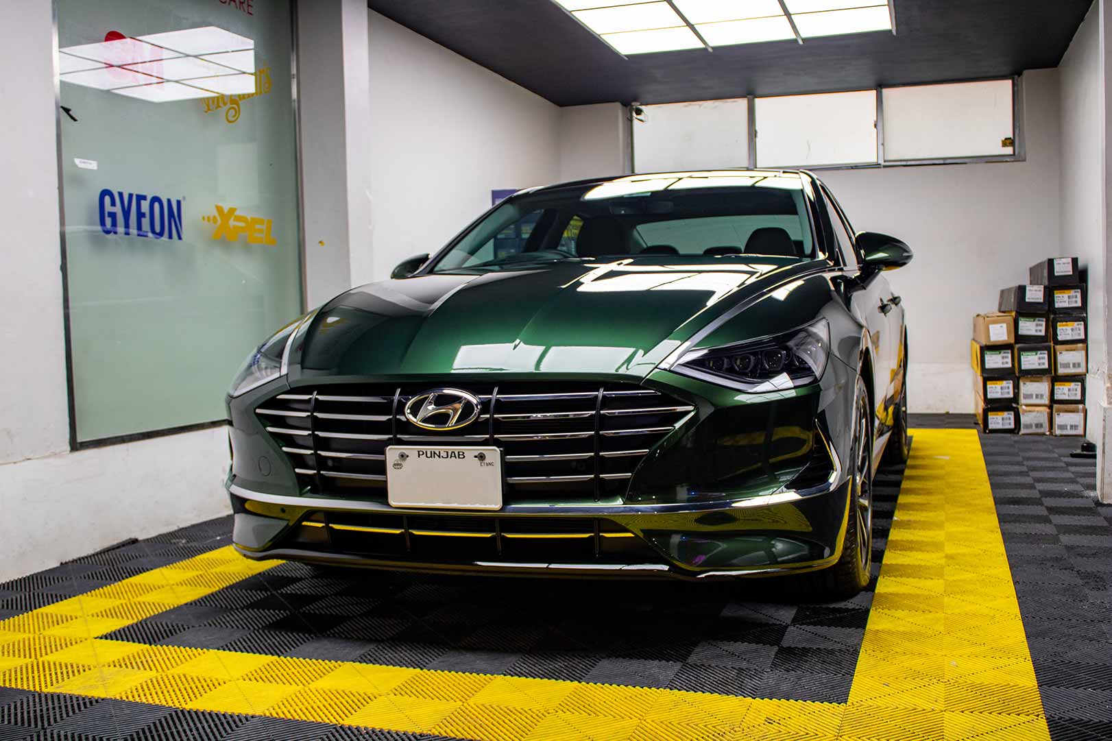 Image of sonata after wrap applied. Wrap is Inozetek Supergloss metallic midnight green. Installed by protek car care, Lahore, Pakistan